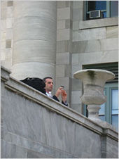 Pfizer worker photographing Harvard students