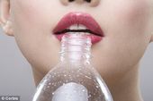 Click to enlarge Young woman's lips with water