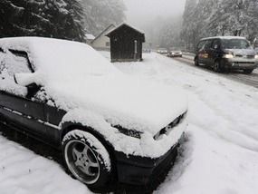 snow-covered car