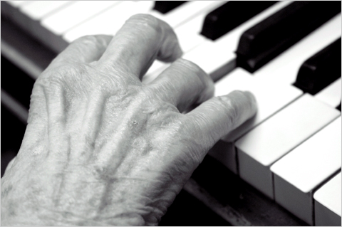 Click to enlarge elderly hands playing piano