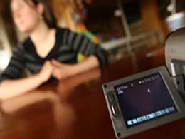 Click to enlarge Woman at desk with recorder