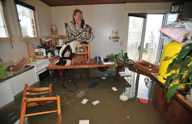 woman waits on a chair atop a table