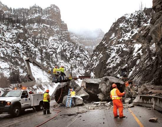 Crews Monday work to clear boulders 