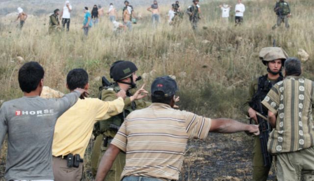 Palestinians complaining to Israeli soldiers