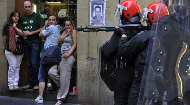 Riot police, civilians