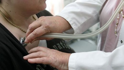 doctor checks the health of a patient
