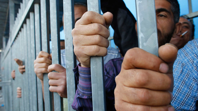 Palestinians at Israeli checkpoint