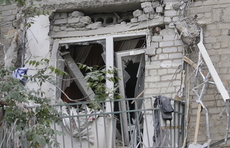 Click to enlarge Bombed residential building in Lugansk