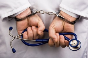 Click to enlarge doctor in handcuffs