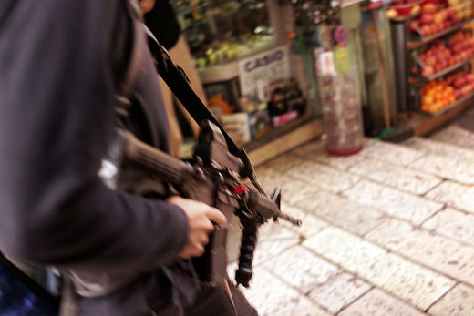 israeli settler opens fire market