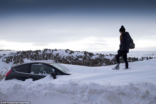 snow buries car Derbyshire