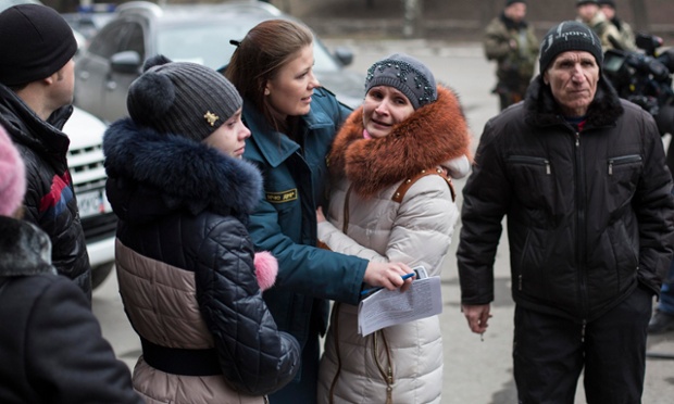 Click to enlarge Family members wait outside the Zasyadko coal mine.
