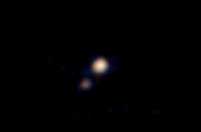 Pluto and its largest moon Charon