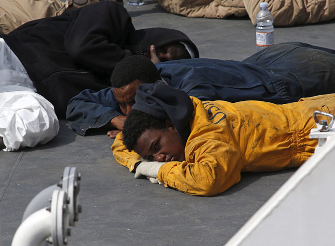 Click to enlarge Surviving immigrants on Italian coastguard ship