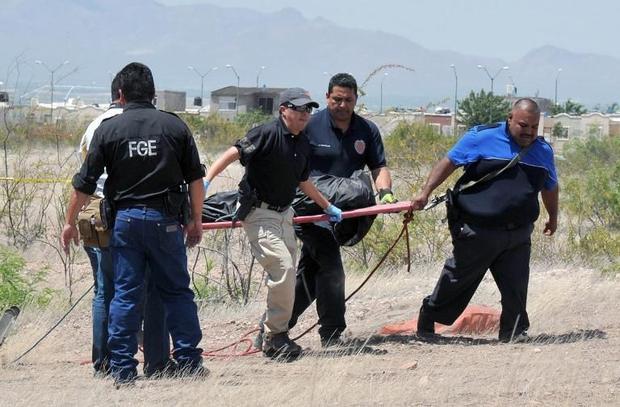 Click to enlarge Forensic personnel