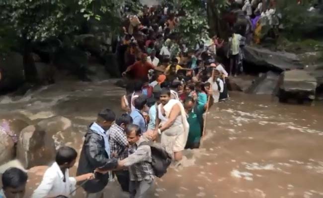 Click to enlarge Pilgrims in India caught in flash flood