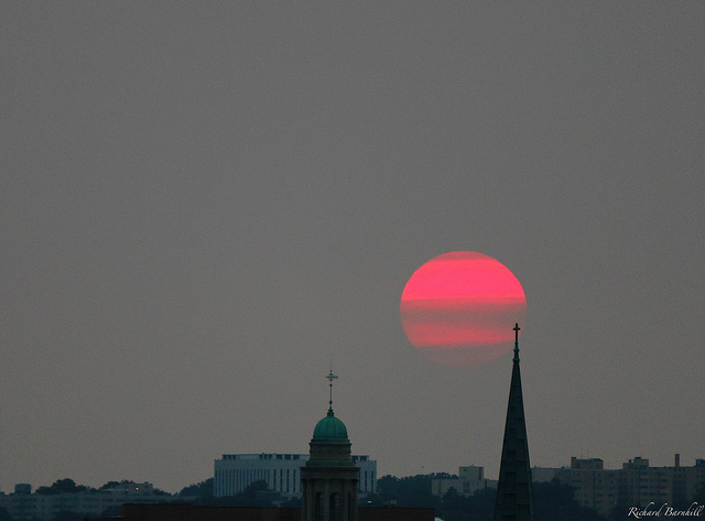 A smoky sunset over the District, June 9, 2015 (Richard Barnhill via Flickr)