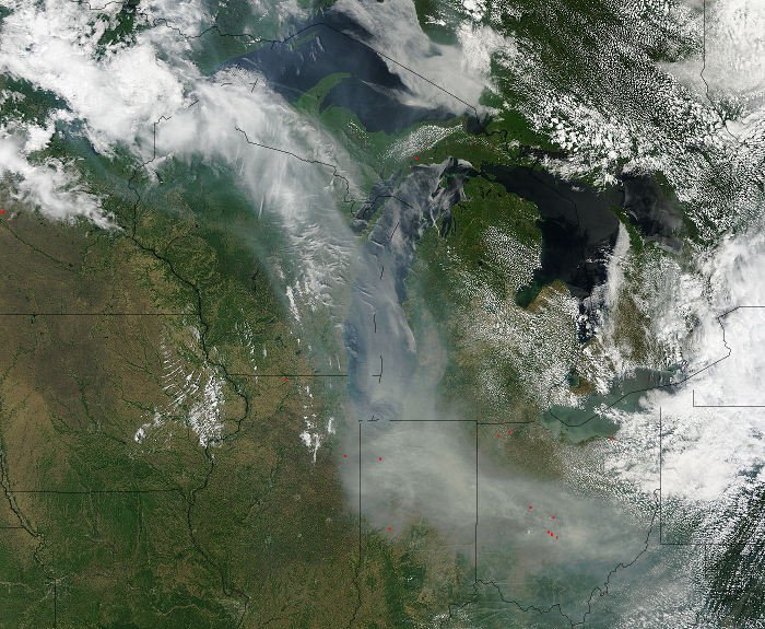 Smoke from Canadian wildfires drifts south into the eastern U.S. on Tuesday afternoon, seen here in a high-resolution visible satellite image. (NASA)