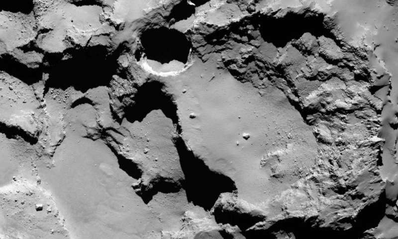 Click to enlarge sinkholes on comet