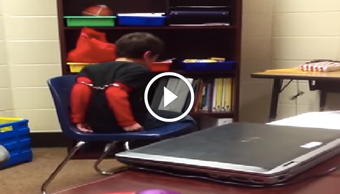 Click to enlarge third grader handcuffed