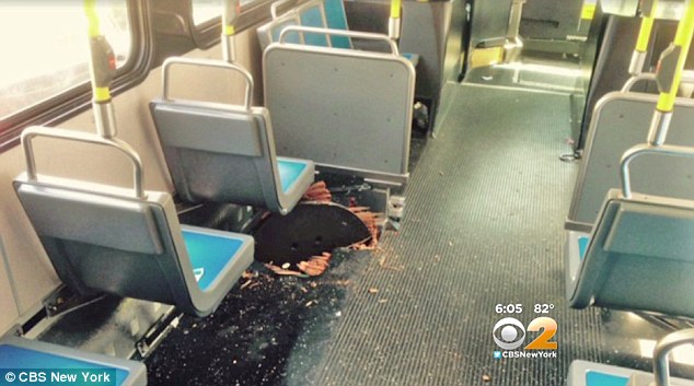 manhole cover explodes into bus