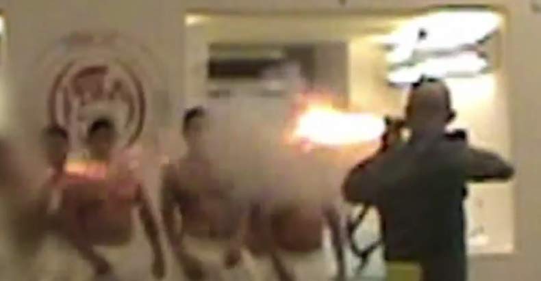 guard fires tear gas prisoner