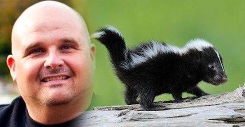 Click to enlarge Officer David Dean and skunk