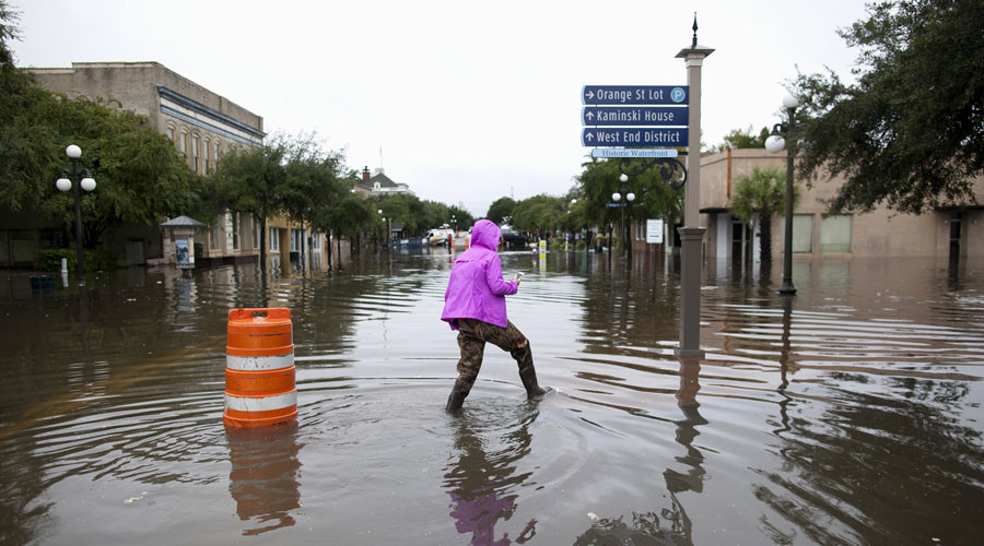 Click to enlarge Woman walks through flooding South Carolina Hurricane Joaquin