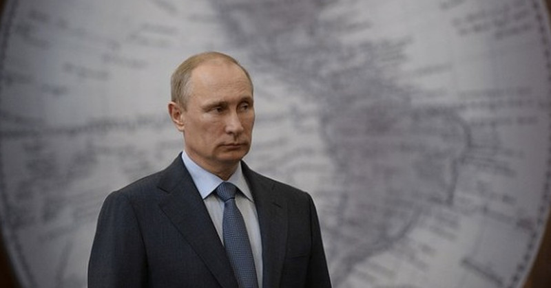 putin in front of globe