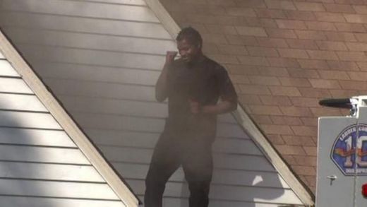 man dances burning house
