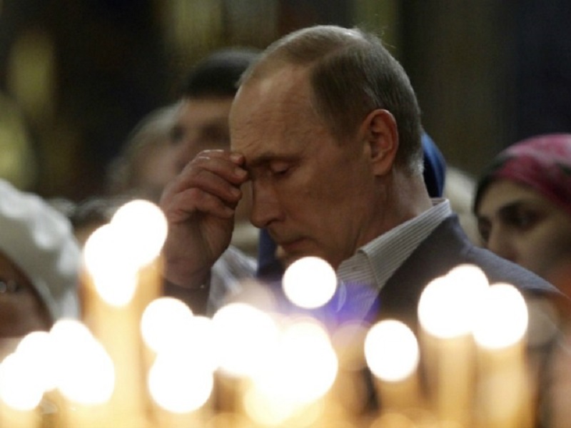 Click to enlarge Putin Praying