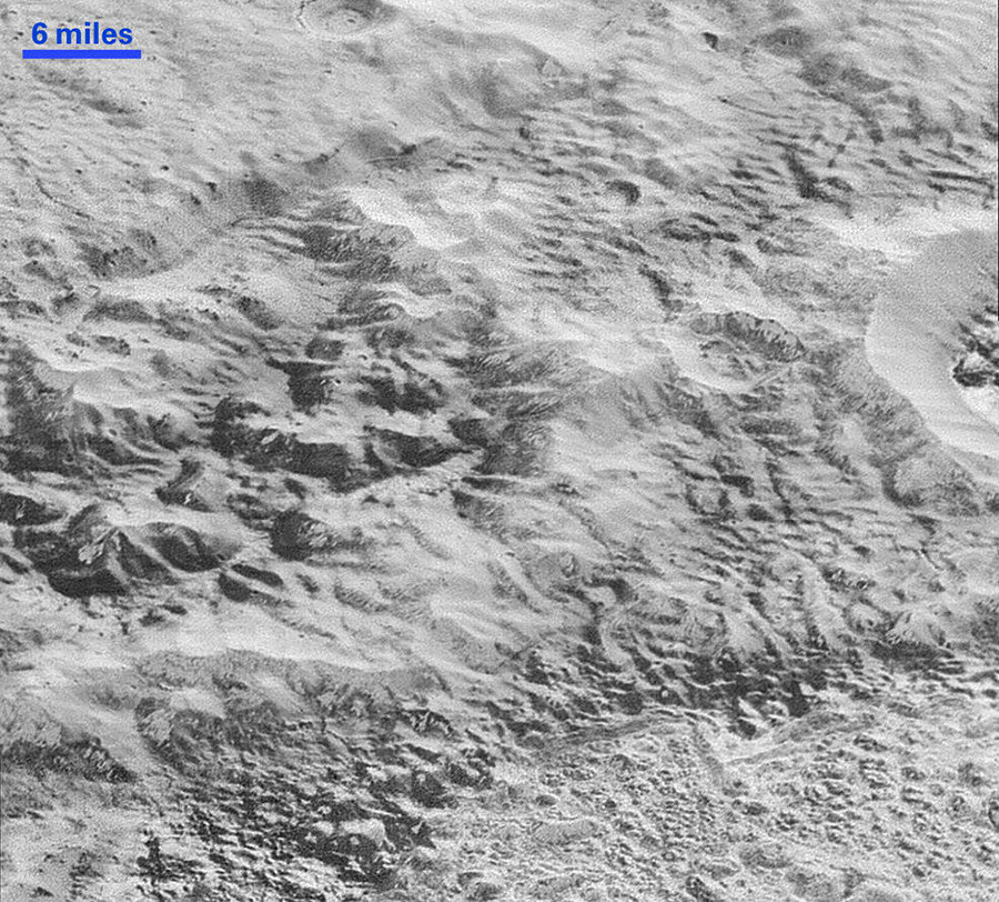 Click to enlarge Pluto’s ‘Badlands’