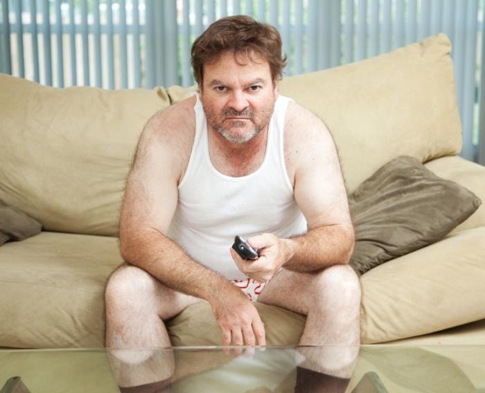 Man watching TV in his underpants