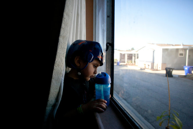 child looking out window