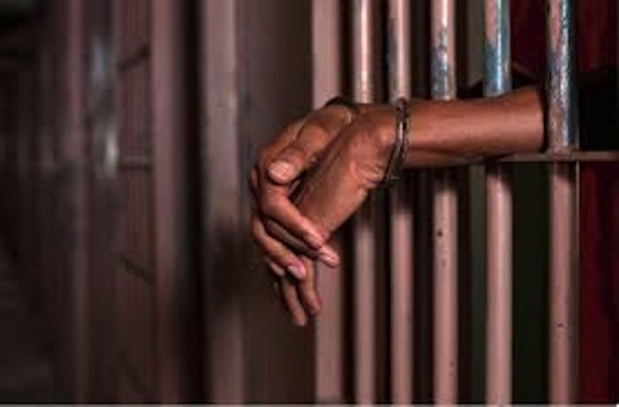 black man behind bars