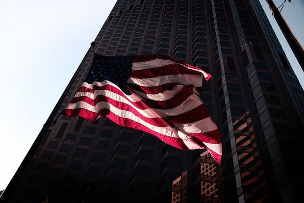 Click to enlarge American flag in from of building