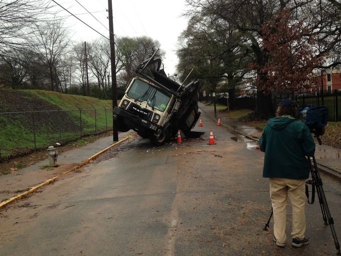 Garbage truck in hole in Atlanta  