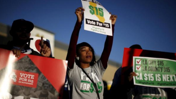 Fast-food workers and their supporters join a nationwide protest for higher wages and union rights outside McDonald's in Los Angeles, California, United States, Nov.10, 2015.