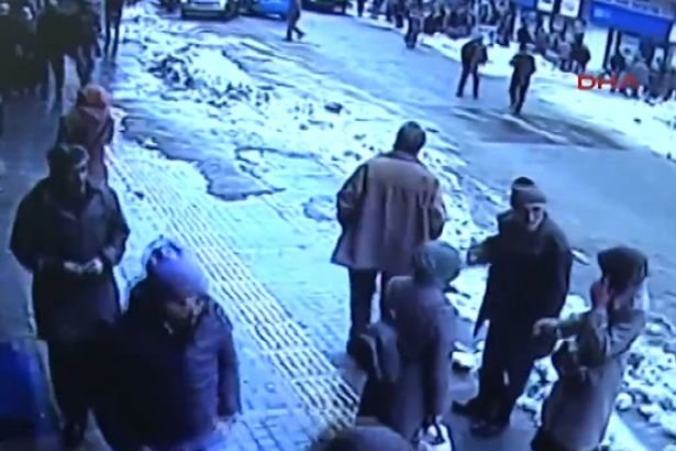Snow falls on shoppers