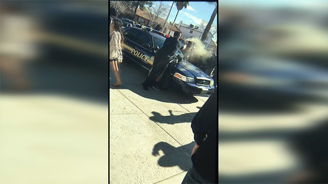 Click to enlarge cop pepper spraying students