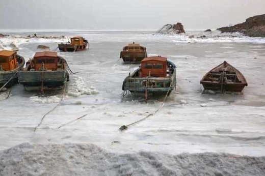 Fishing boats frozen by sea ice in China