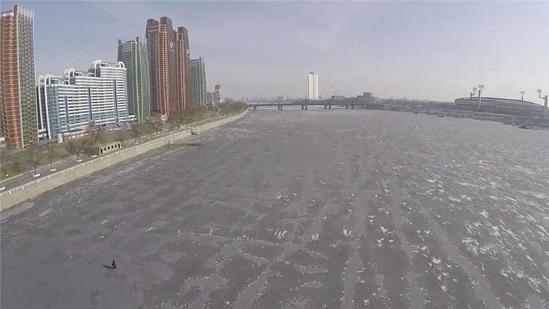 Click to enlarge An aerial view of the frozen Taedong River in Pyongyang on Wednesday
