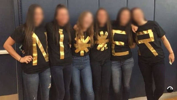 Six senior girls photographed spelling out racial slur.