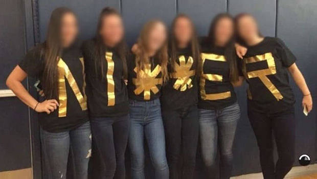 Click to enlarge Six senior girls photographed spelling out racial slur.