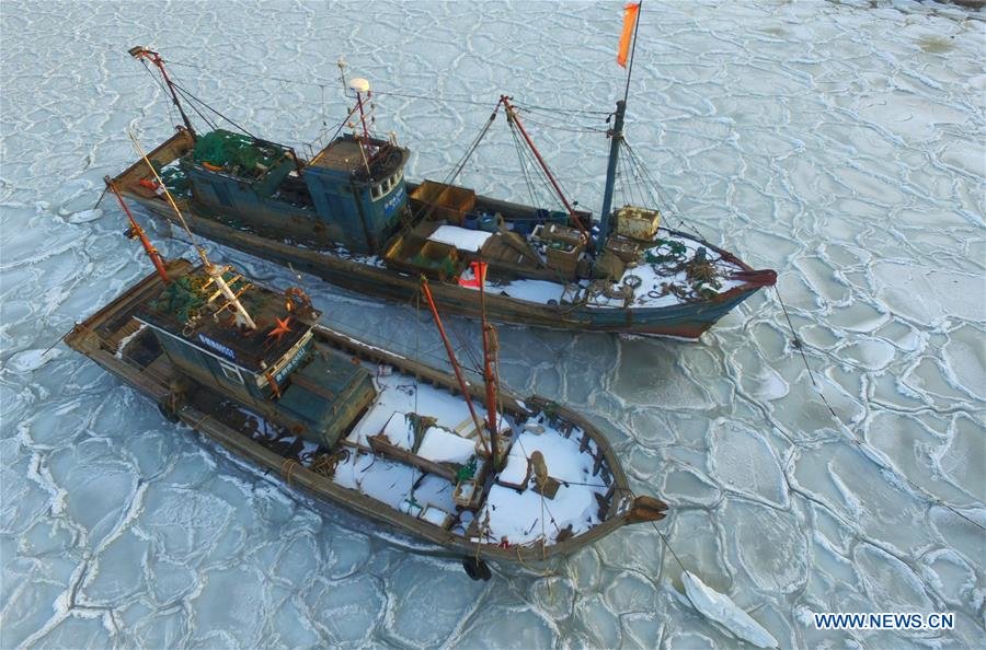 Fishing boats trapped in sea ice, China