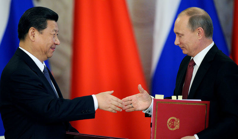 Click to enlarge xi putin handshake