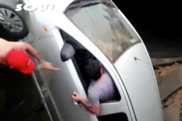 Click to enlarge car was swallowed up by an enormous sinkhole
