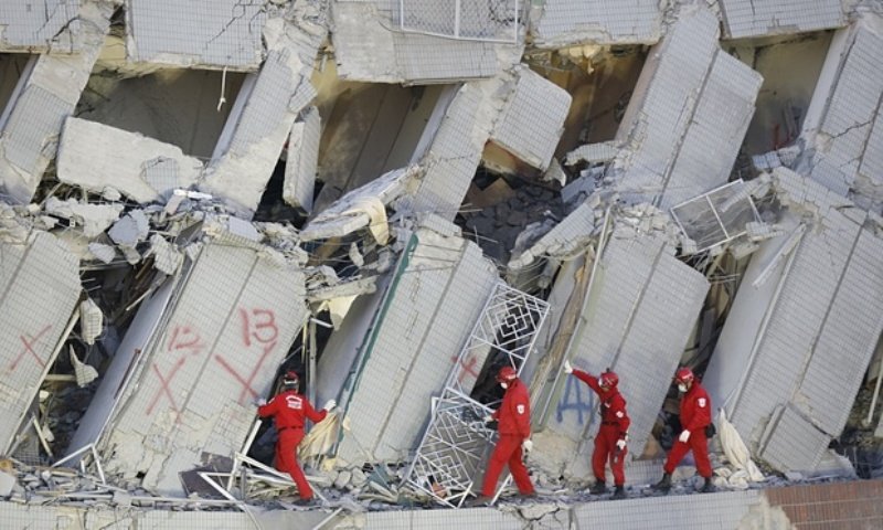 Rescuers in the collapsed building in Tainan