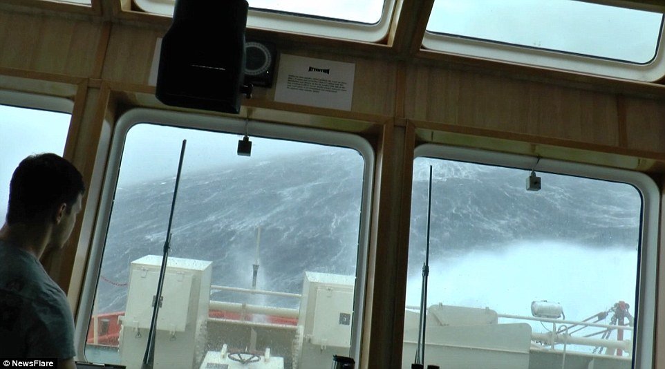 Click to enlarge Rocking: Worryingly the ship can even be heard creaking under the sheer weight of the devastating storm