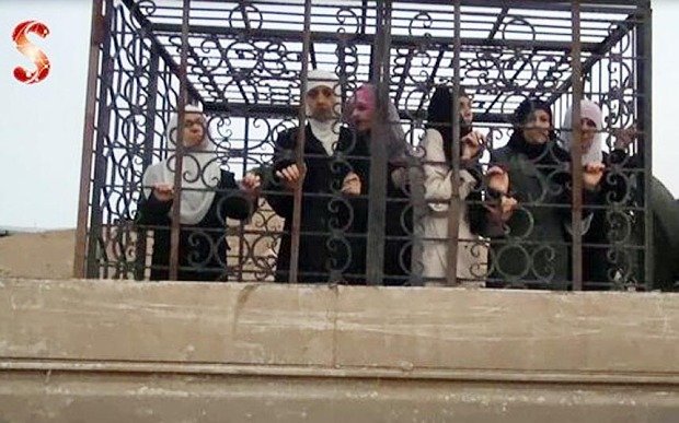 Click to enlarge caged civilians Syria